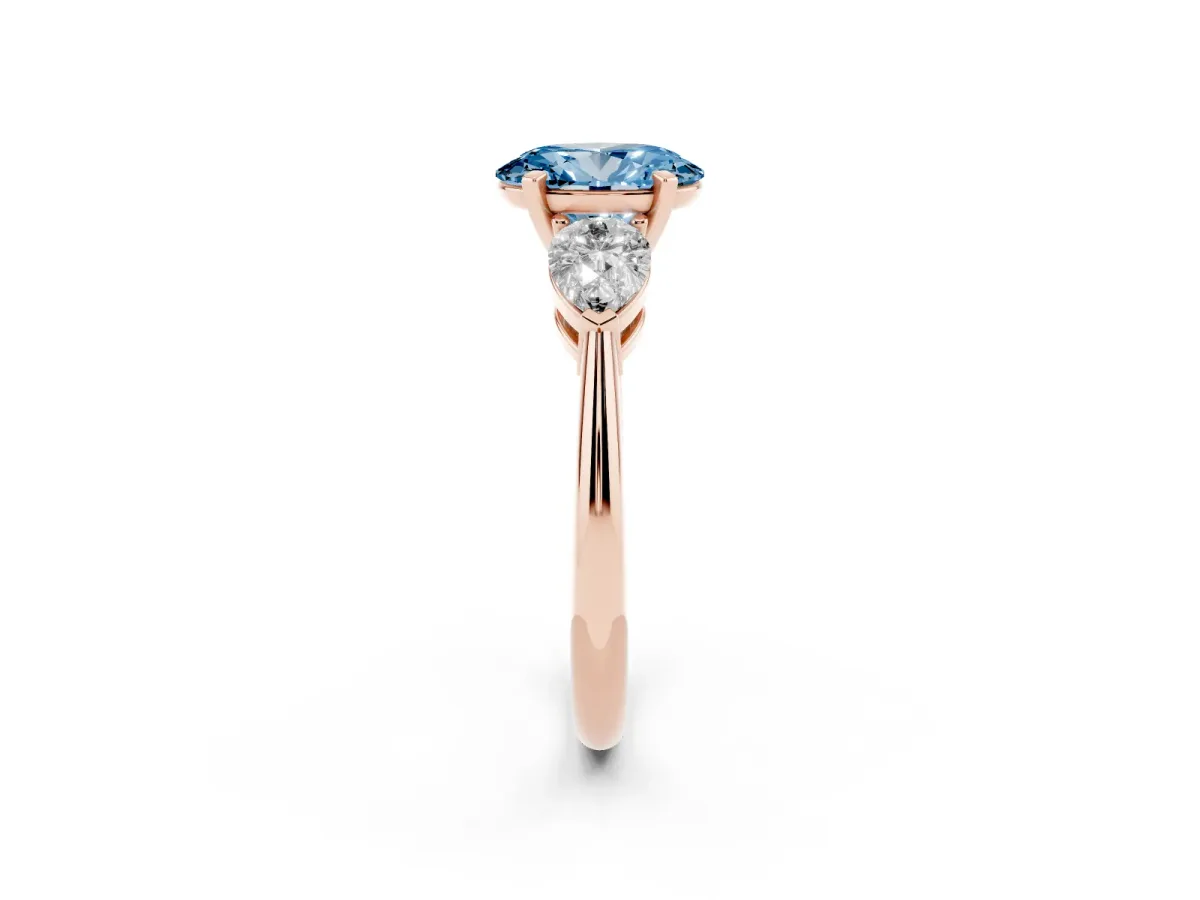 Fancy Blue Three-Stone Oval Cut Diamond Ring with Pear Side Stones and Four-Prong Setting Rose gold