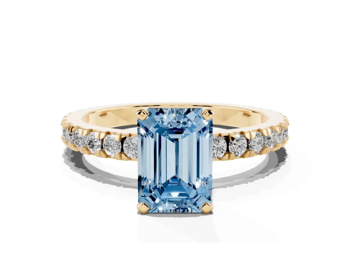 Fancy Blue Emerald Cut Diamond Pavé Band Solitaire with Four-Prong Setting Yellow gold