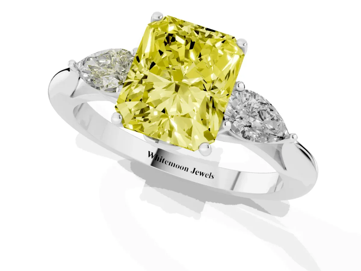 Fancy Yellow Three-Stone Radiant Cut Diamond Ring with Pear Side Stones in Four-Prong Setting Silver
