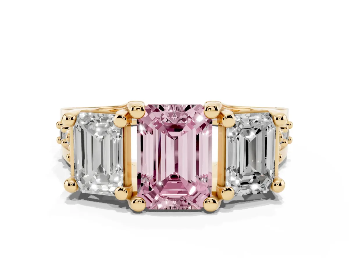 Fancy Pink Emerald Cut Diamond Three-Stone Ring with Channel Set Band and Four-Prong Setting Yellow gold