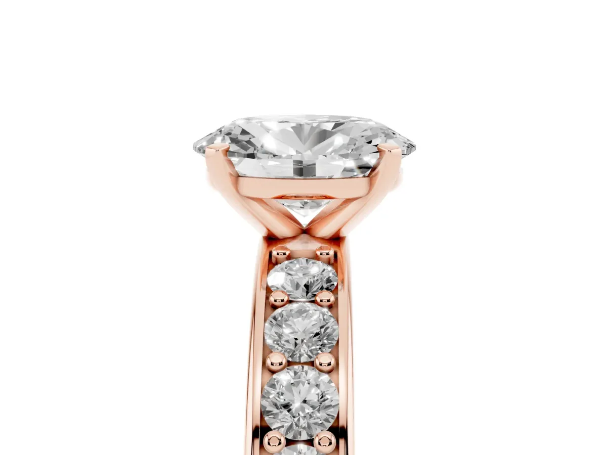 Oval Cut Diamond Engagement Ring with Channel Set Round Band and Prong Setting Rose gold