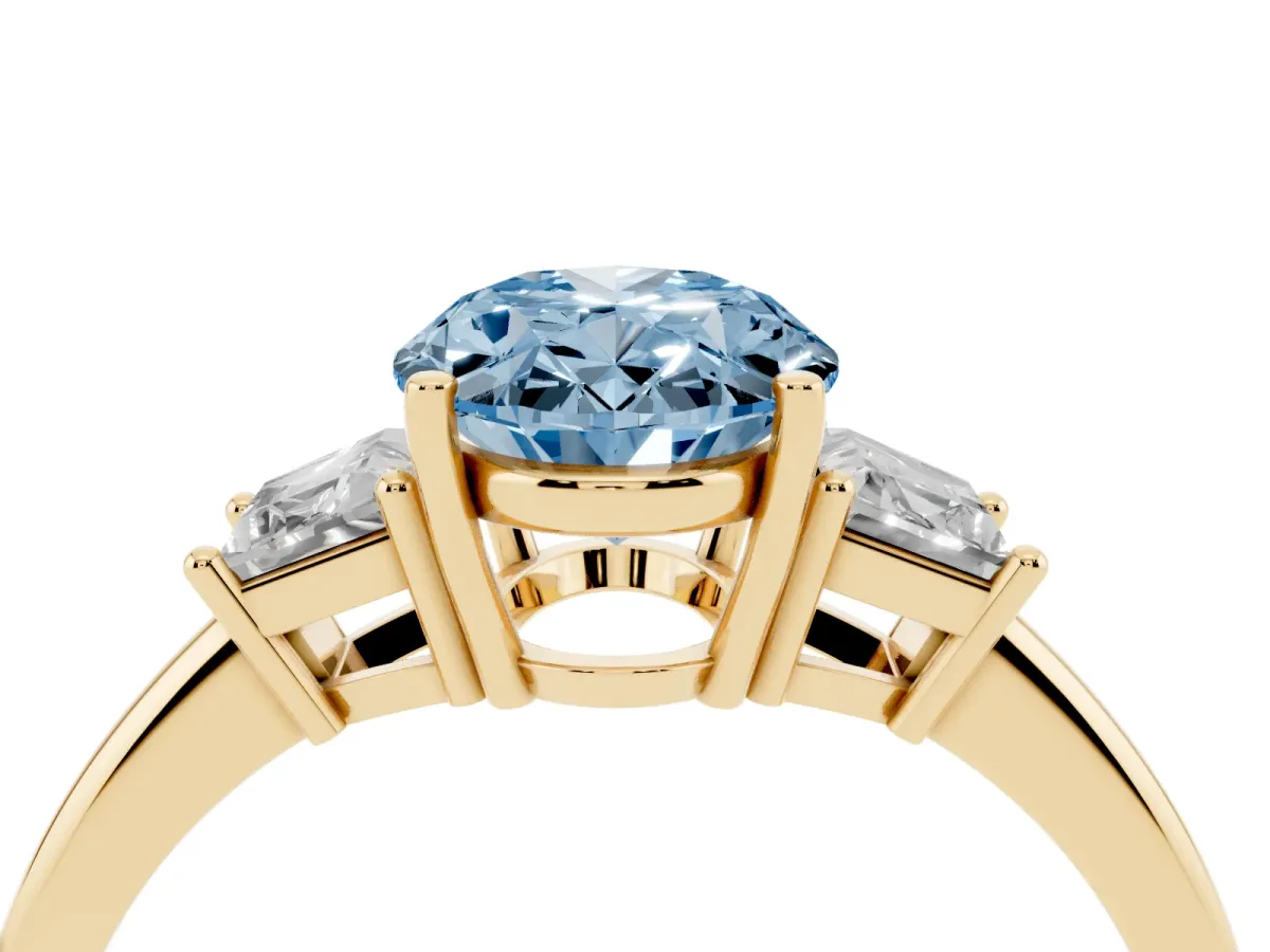 Fancy Blue Oval Cut Diamond Three-Stone Ring with Trapezoid Side Stones and Prong Setting Yellow gold