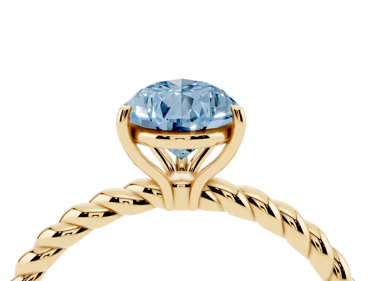 Fancy Blue Pear Cut Solitaire Twist Band Ring with Four-Prong Setting Yellow gold