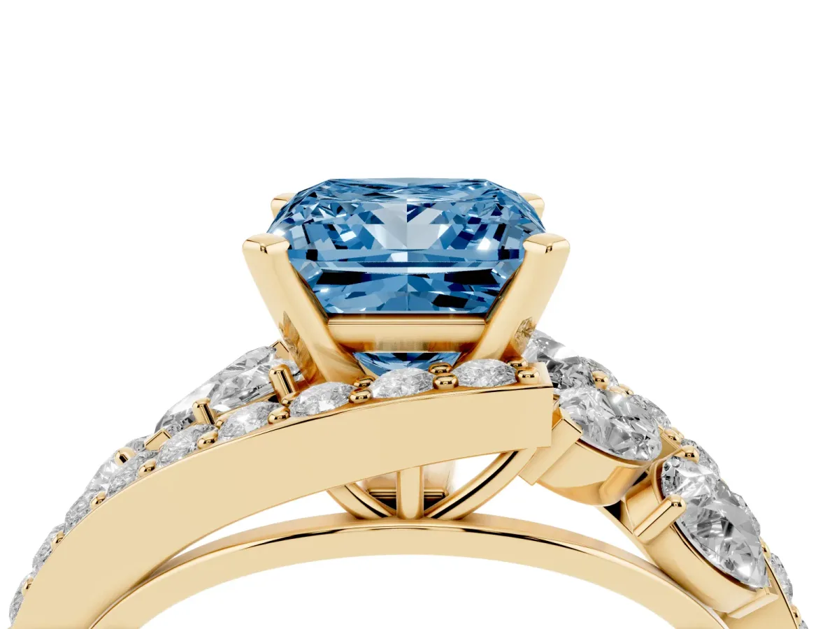Fancy Blue Princess Cut Diamond Halo Ring with Marquise and Pavé Band in Prong Setting Yellow gold