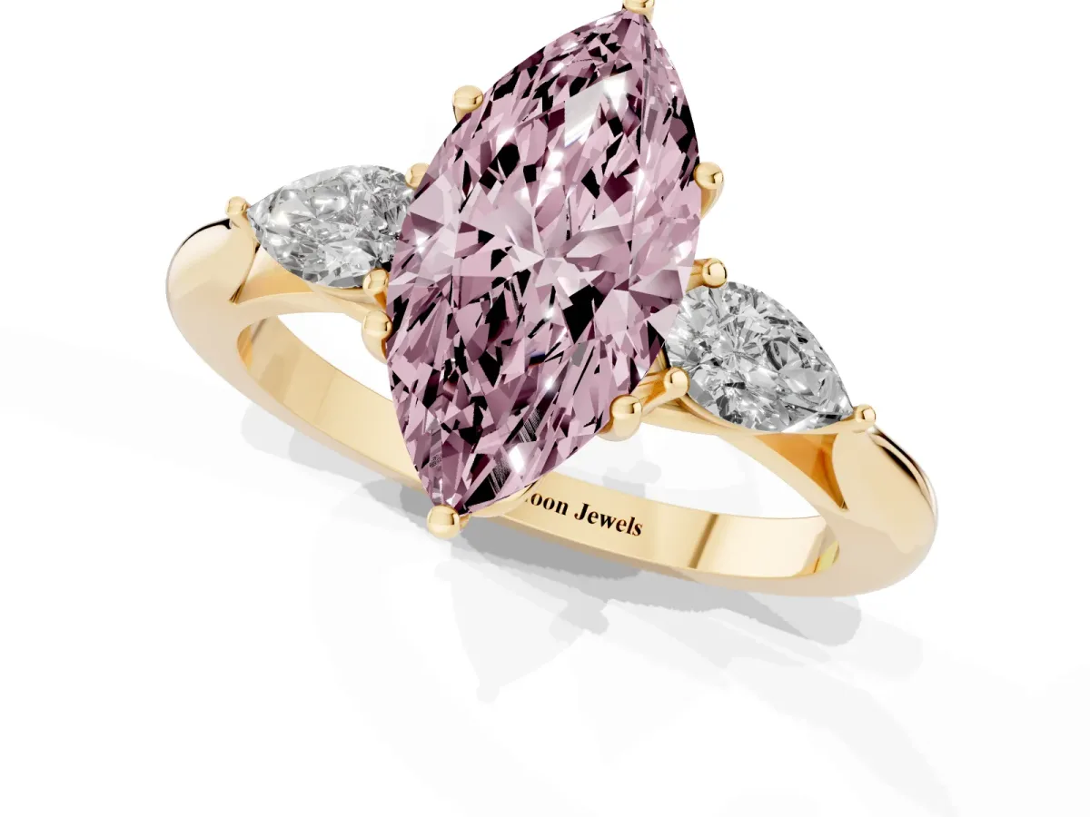 Fancy Pink Marquise Cut Diamond Three-Stone Ring with Pear Side Stones and Prong Setting Yellow gold