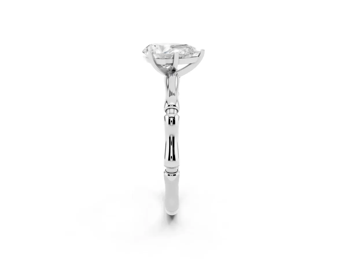 Pear Cut Solitaire Diamond Ring with Bamboo Band and Four-Prong Setting Platinum