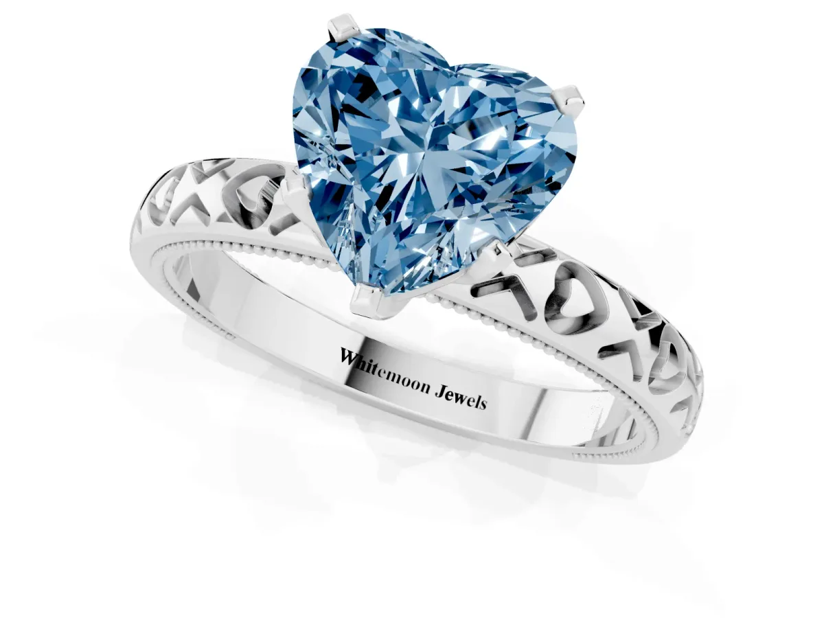 Fancy Blue Heart Cut Solitaire Diamond Engagement Ring with XO Engraved Band and Four-Prong Setting Silver