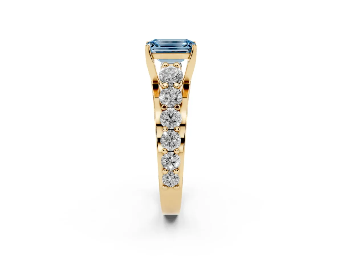 Fancy Blue Emerald Cut Diamond Engagement Ring with Pavé Band and Four-Prong Setting Yellow gold