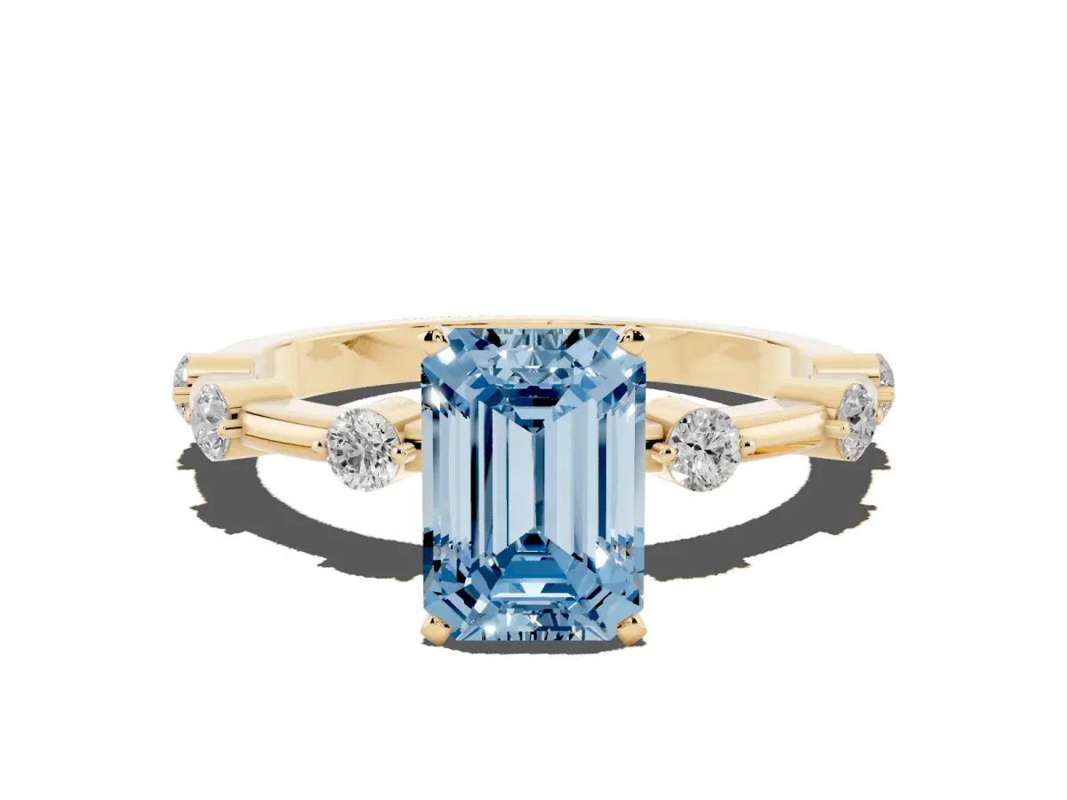 Fancy Blue Emerald Cut Solitaire Diamond Ring with Bezel Set Side Stones and Prong Setting Yellow gold
