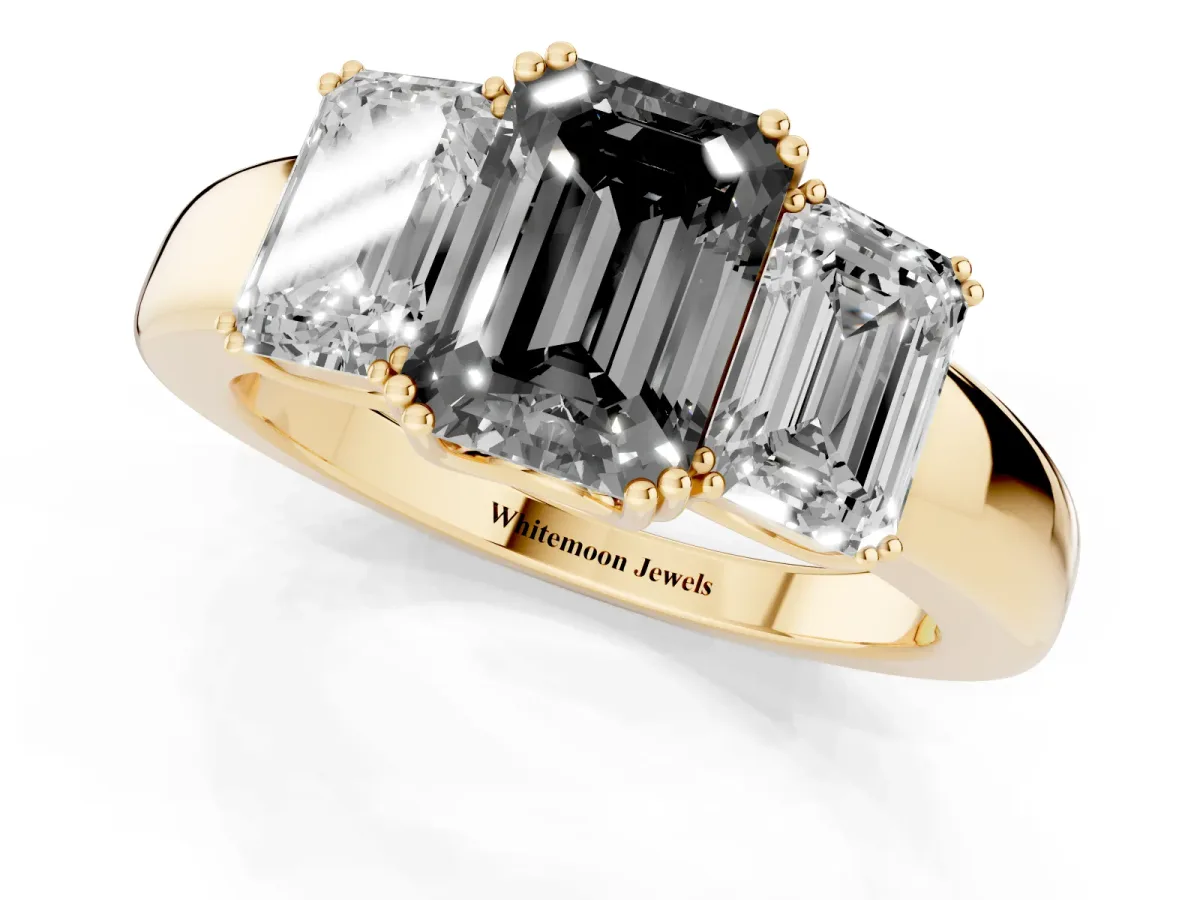 Fancy Black Three-Stone Emerald Cut Cut Diamond Ring with Channel Set Band and Four-Prong Setting Yellow gold