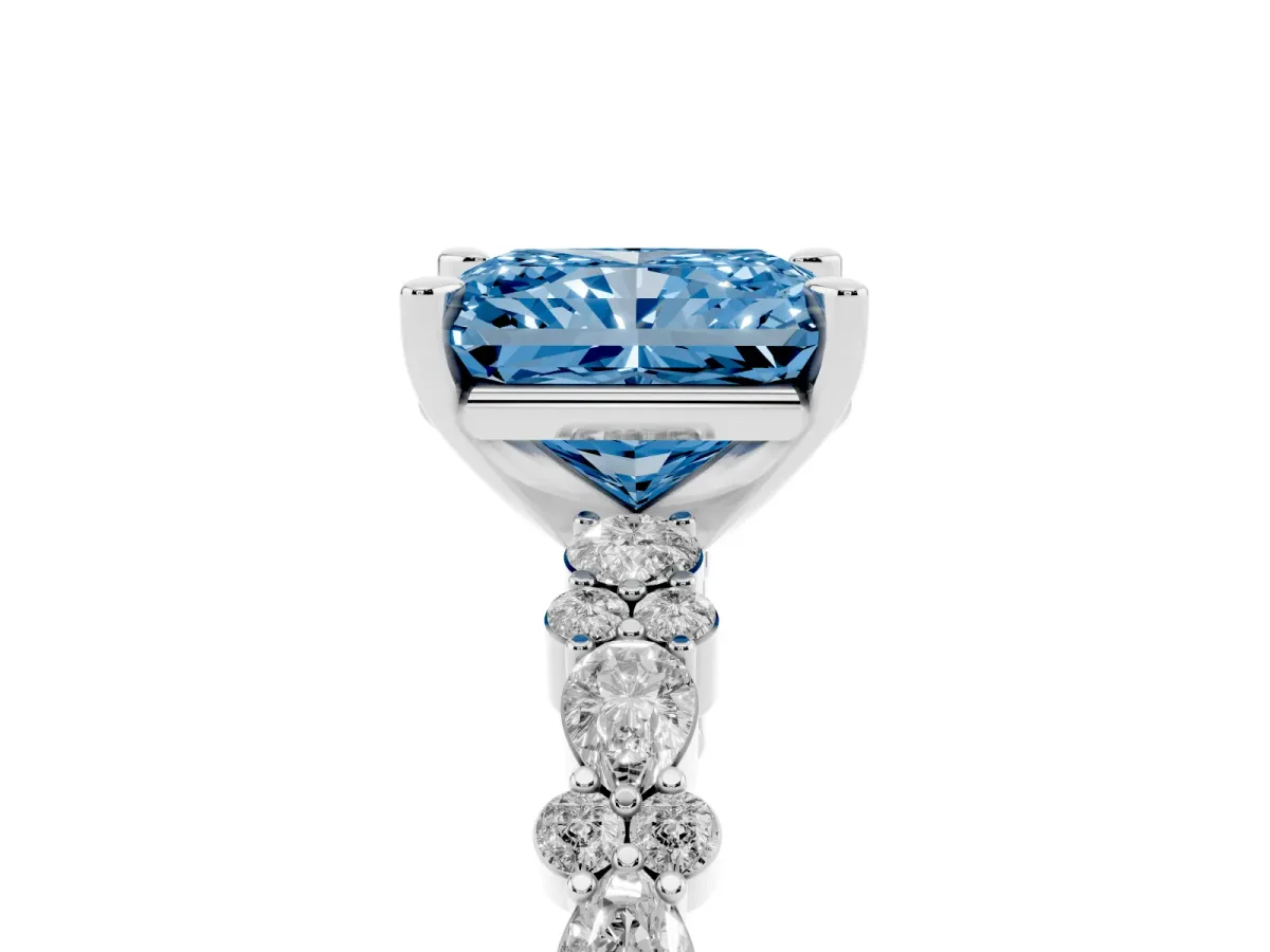 Fancy Blue Radiant Cut Diamond Side Stone Solitaire Ring with Round and Four-Prong Setting Platinum