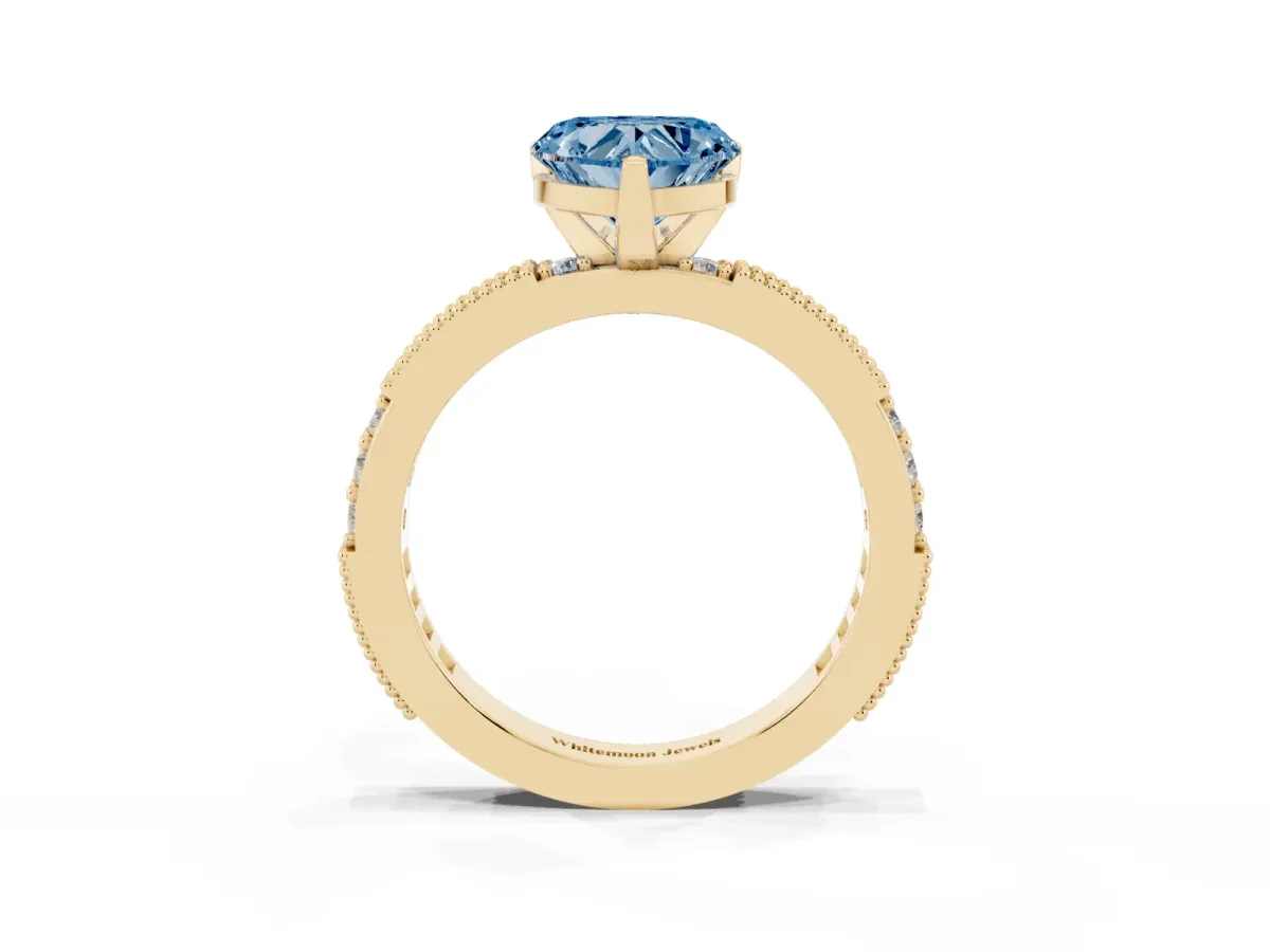 Fancy Blue Heart Cut Solitaire with Pavé Band and Four-Prong Setting Yellow gold