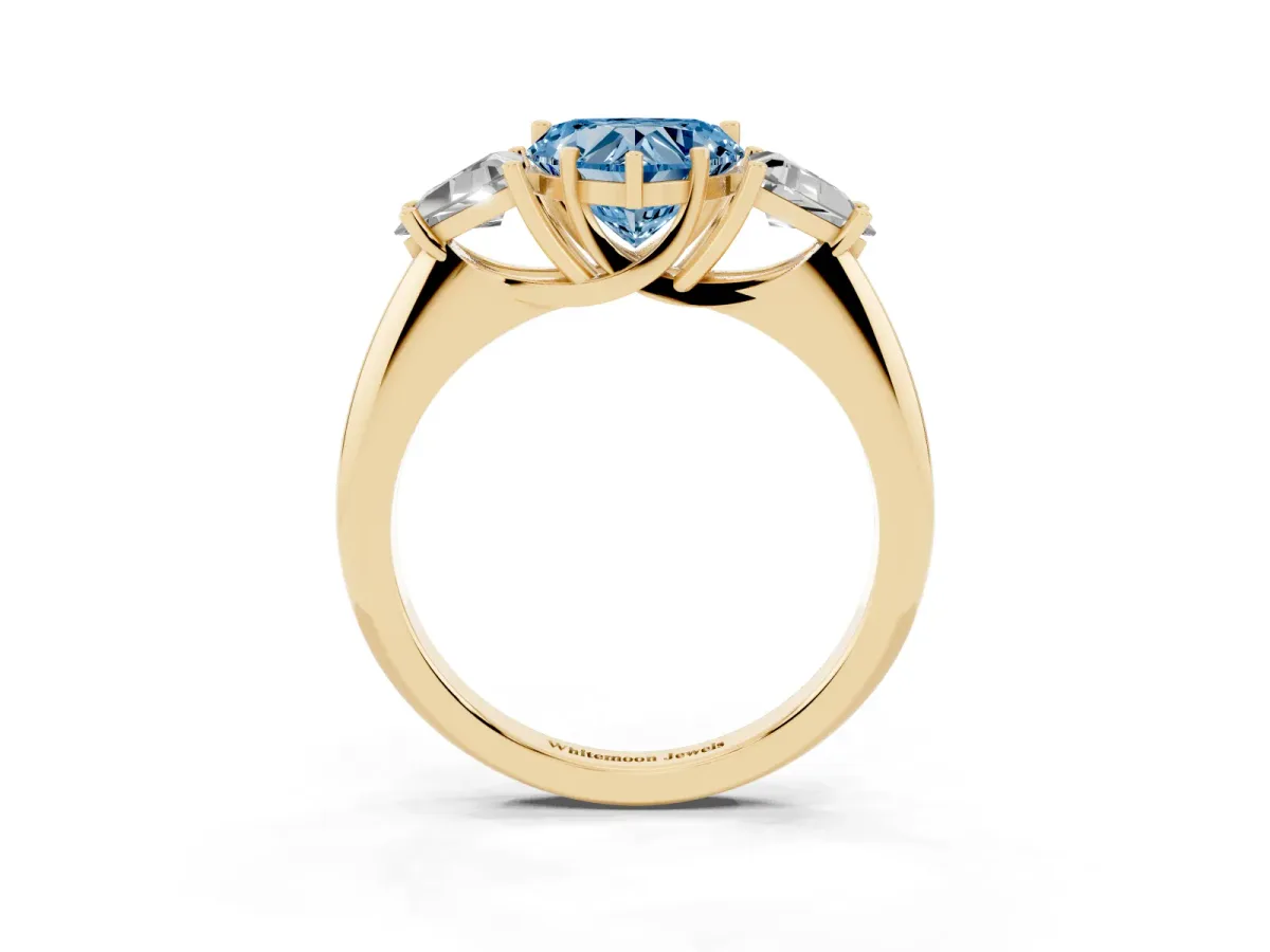 Fancy Blue Three-Stone Heart Cut Diamond Engagement Ring with Trillion Side Stones and Prong Setting Yellow gold
