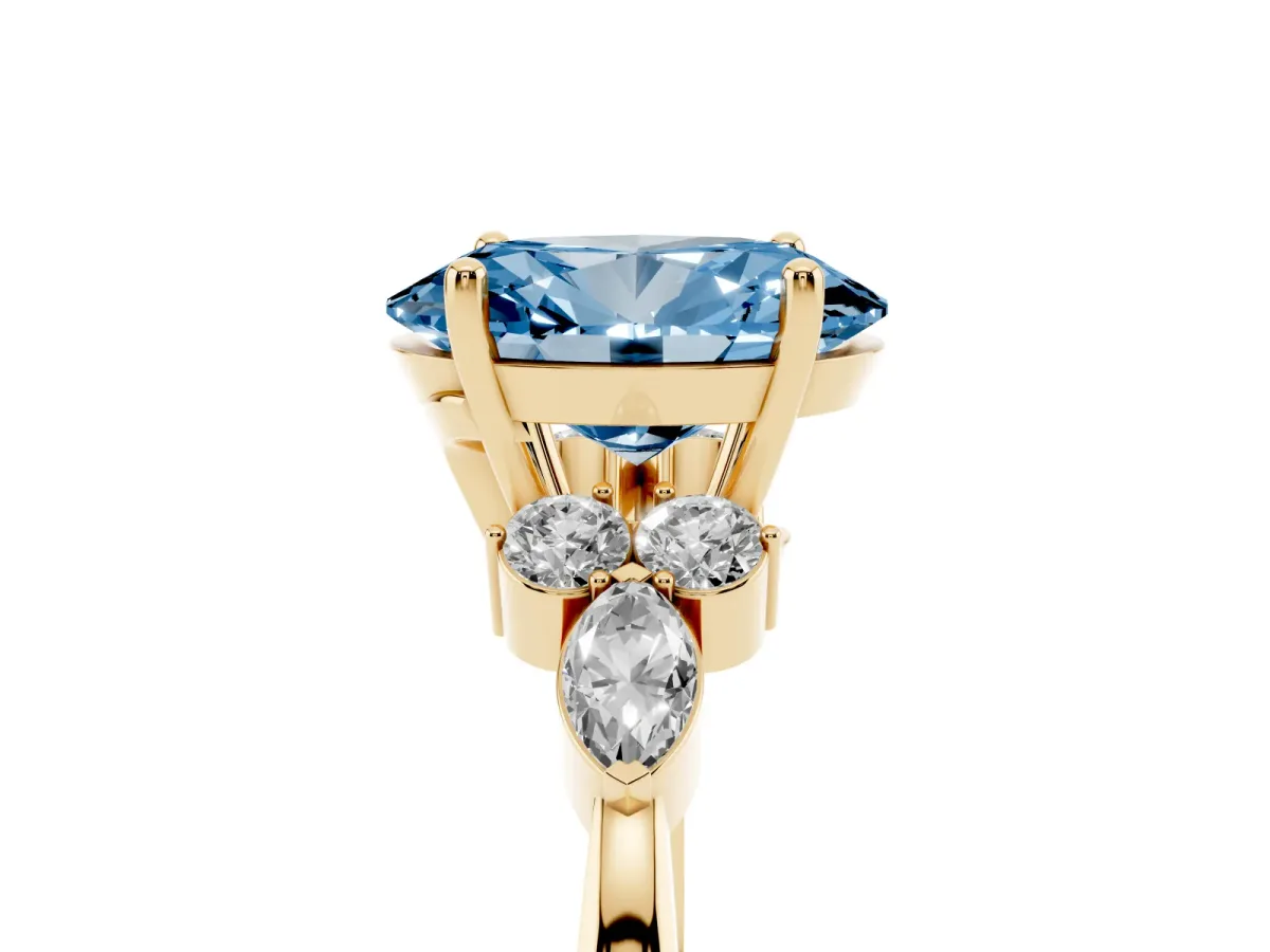 Fancy Blue Oval Cut Brilliant Diamond Solitaire Ring with Pear Side Stones and Four-Prong Setting Yellow gold