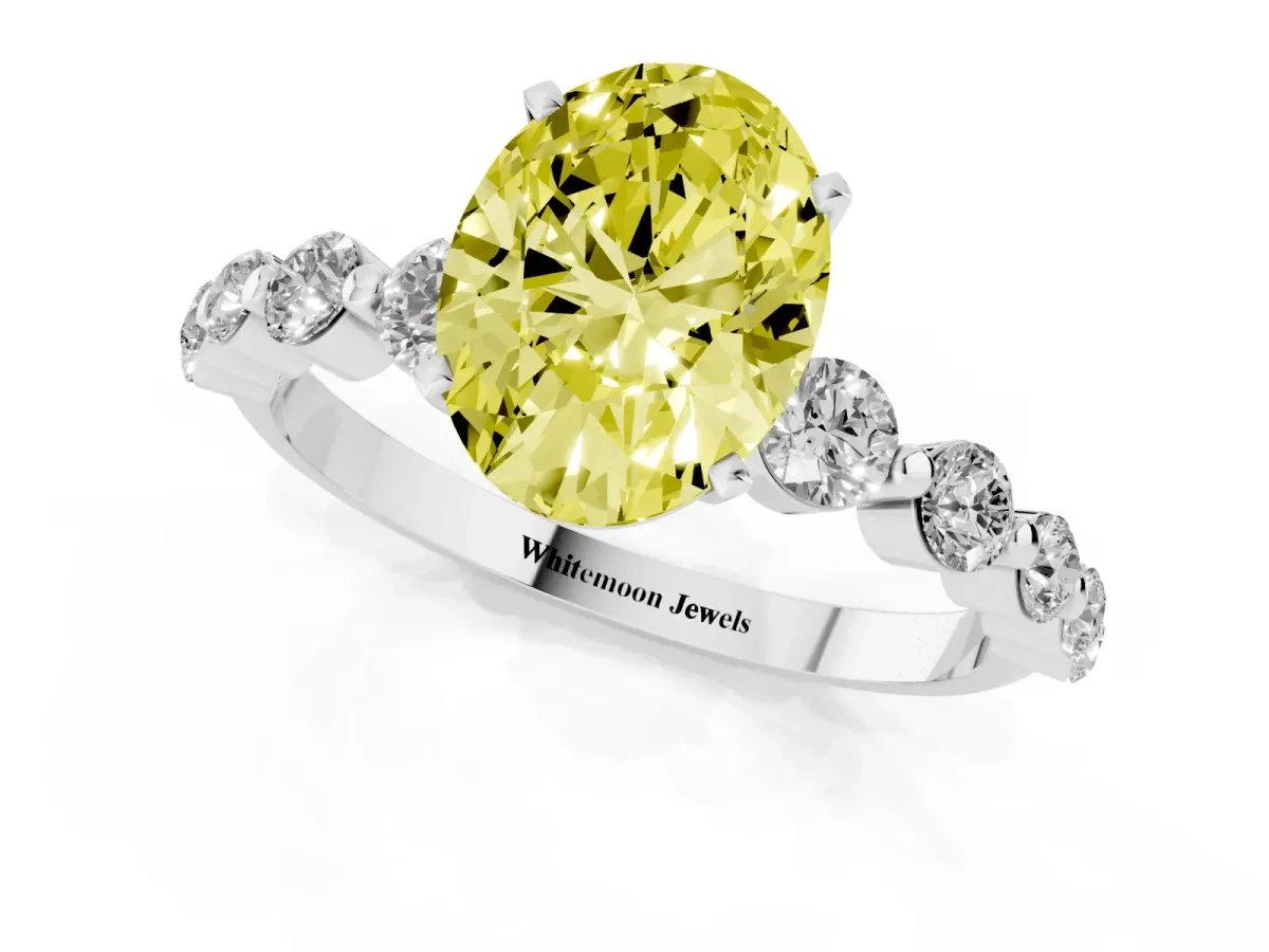 Fancy Yellow Oval Cut Solitaire Diamond Ring with Pave Band and Four-Prong Setting Silver