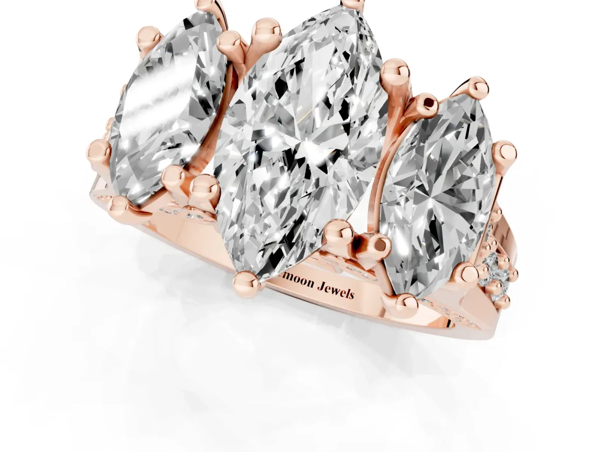 Marquise Cut Diamond Three-Stone Ring with Channel Set Band and Four-Prong Setting Rose gold