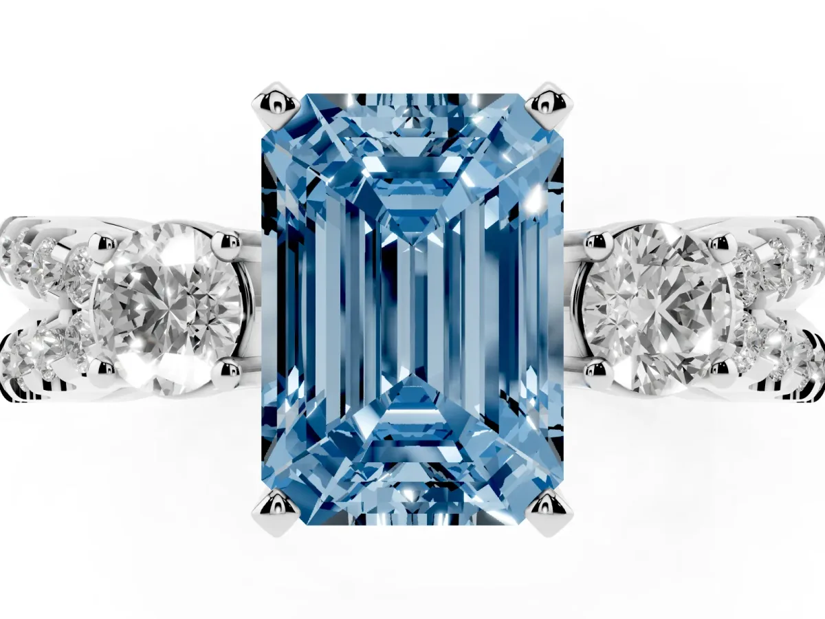 Fancy Blue Emerald Cut Diamond Three-Stone Ring with Pavé Split Shank and Four-Prong Setting Silver