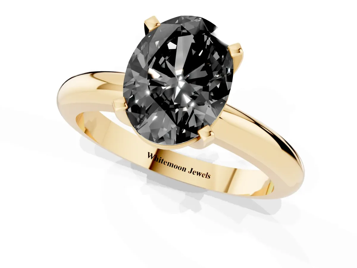 Fancy Black Oval Cut Diamond Solitaire Engagement Ring with Round Band and Four-Prong Setting Yellow gold