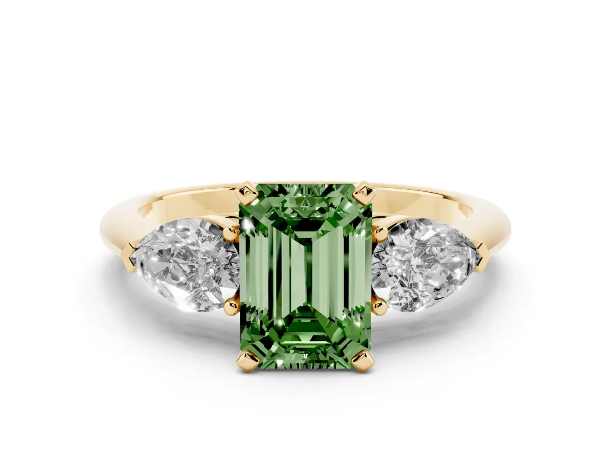 Fancy Green Three-Stone Emerald Cut Diamond Ring with Pear Side Stones and Four-Prong Setting Yellow gold