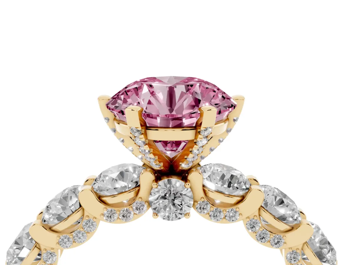 Fancy Pink Round Cut Diamond Side Stone Engagement Ring with Four-Prong Setting Yellow gold