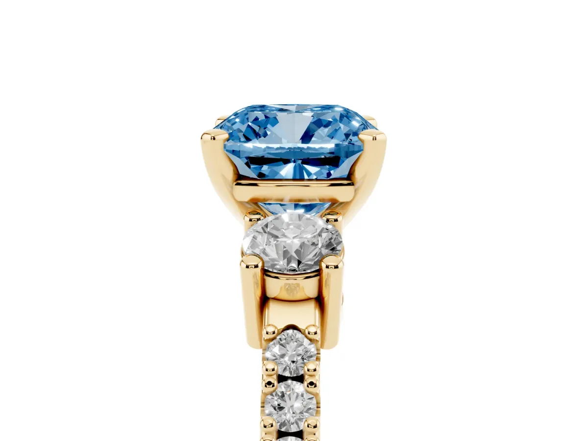 Fancy Blue Cushion Cut Three-Stone Diamond Pavé Band with Prong Setting Yellow gold