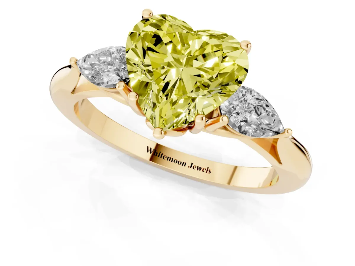 Fancy Yellow Heart Cut Diamond Three-Stone Ring with Pear Side Stones and Prong Setting Yellow gold