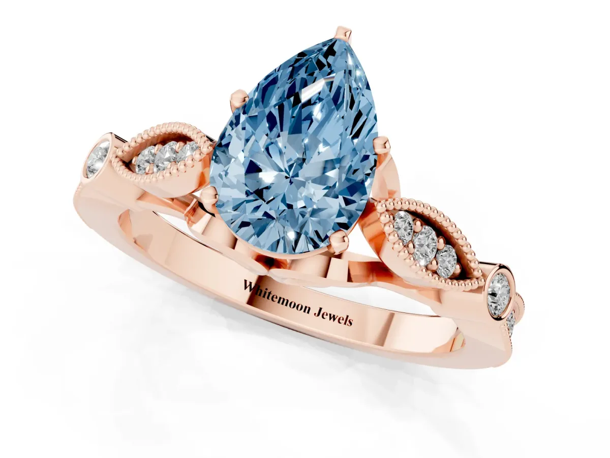 Fancy Blue Pear Cut Cut Diamond with Milgrain Marquise and Bezel Accents on a Solitaire Band with Prong Setting Rose gold