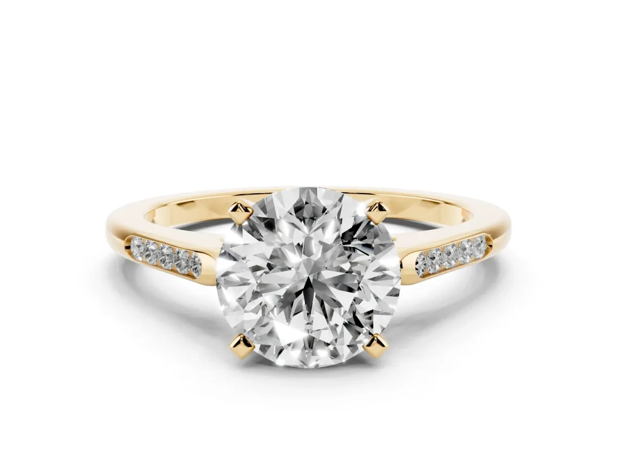 Round Cut Diamond Solitaire Ring with Channel Set Round Band and Prong Setting Yellow gold