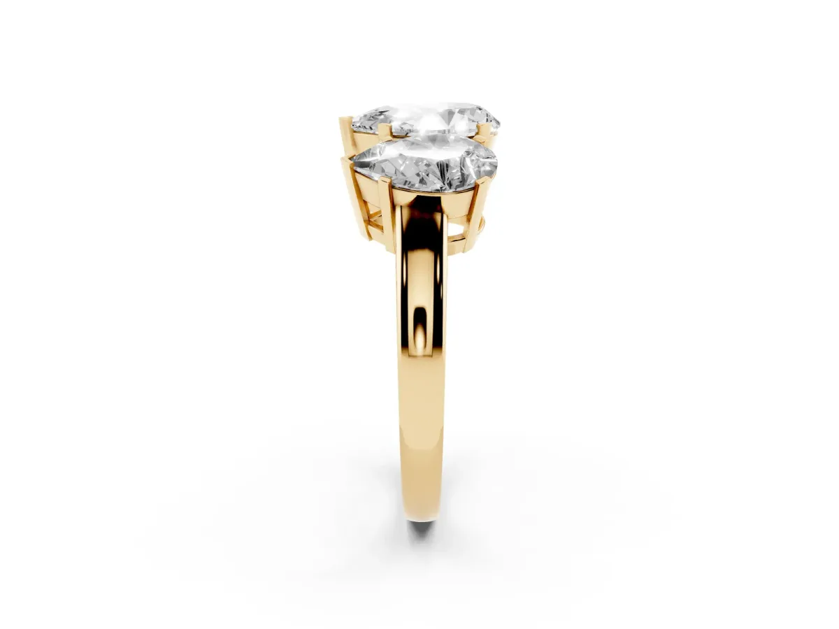 Three-Stone Pear Cut Cut Diamond Ring with Channel Set Band and Four-Prong Setting Yellow gold