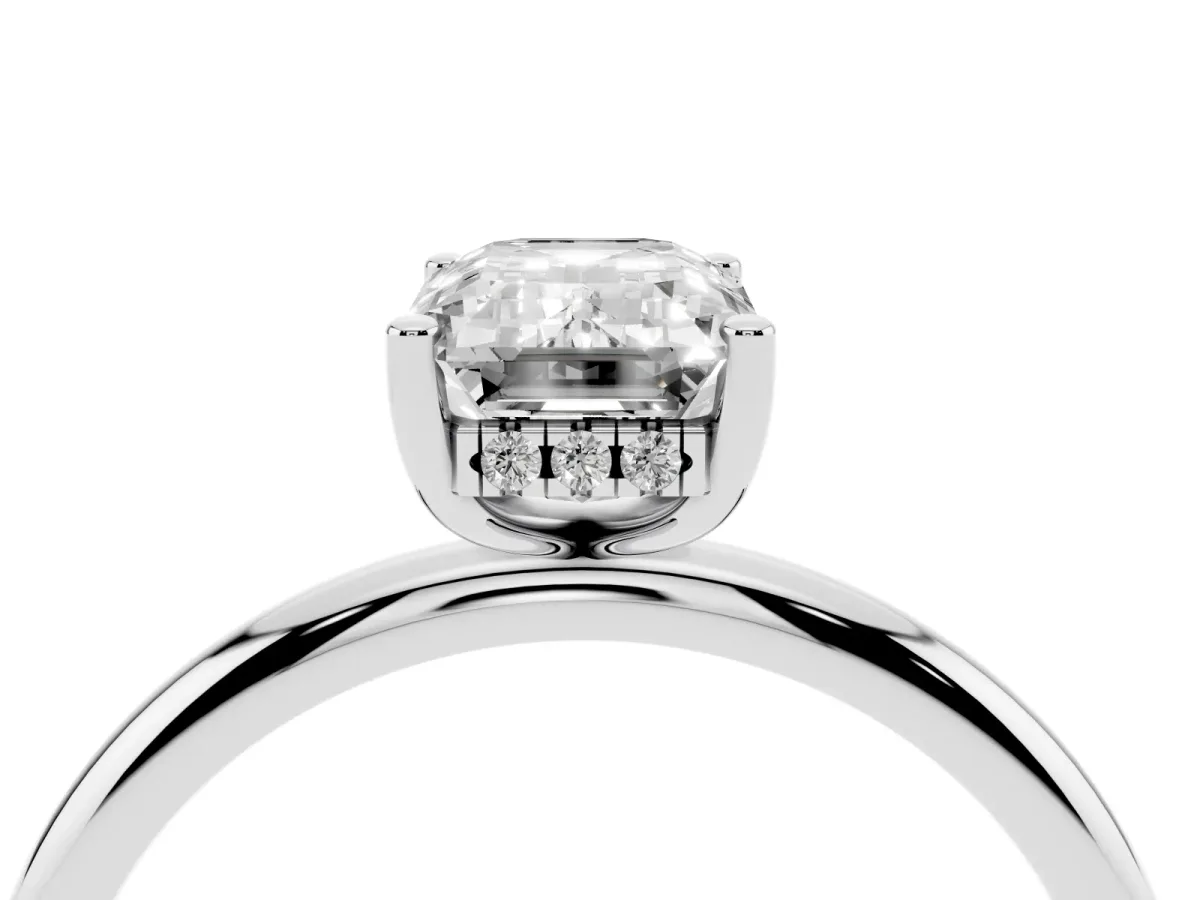 Emerald Cut Cut Solitaire Engagement Ring with Four-Prong Setting and Classic Band Silver