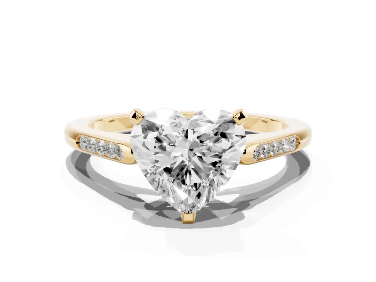 Heart Cut Diamond Solitaire Ring with Channel Set Round Band and Prong Setting Yellow gold