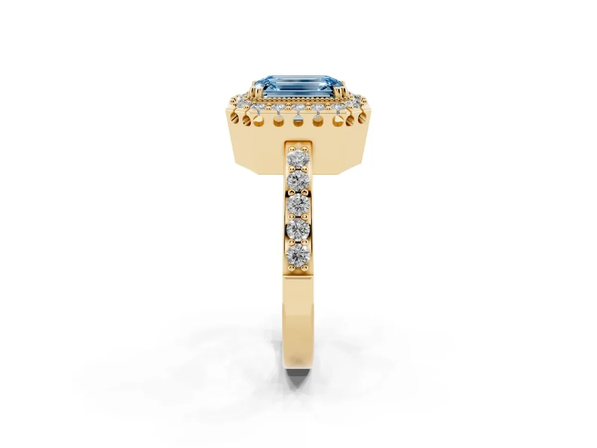 Fancy Blue Emerald Cut Diamond Halo Ring with Pavé Band and Prong Setting Yellow gold