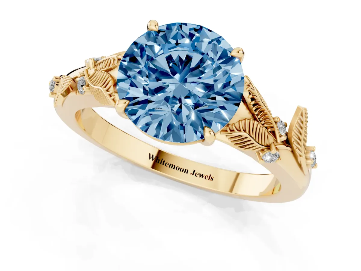 Fancy Blue Round Cut Diamond Solitaire Ring with Leaf Motif Band and Four-Prong Setting Yellow gold