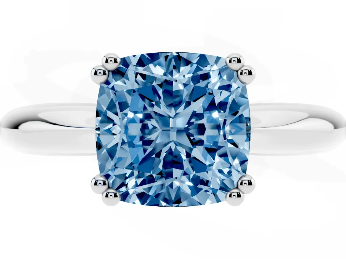 Fancy Blue Cushion Cut Cut Solitaire Engagement Ring with Tapered Band and Four-Prong Setting Platinum