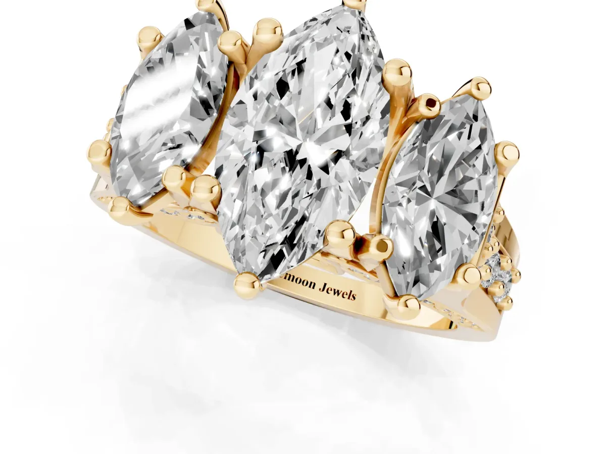 Marquise Cut Diamond Three-Stone Ring with Channel Set Band and Four-Prong Setting Yellow gold