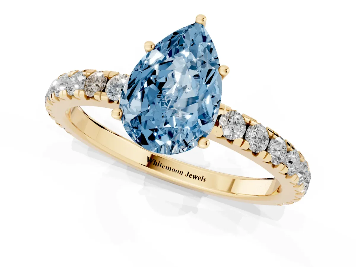 Fancy Blue Pear Cut Diamond Pavé Solitaire Engagement Ring with Four-Prong Setting Yellow gold