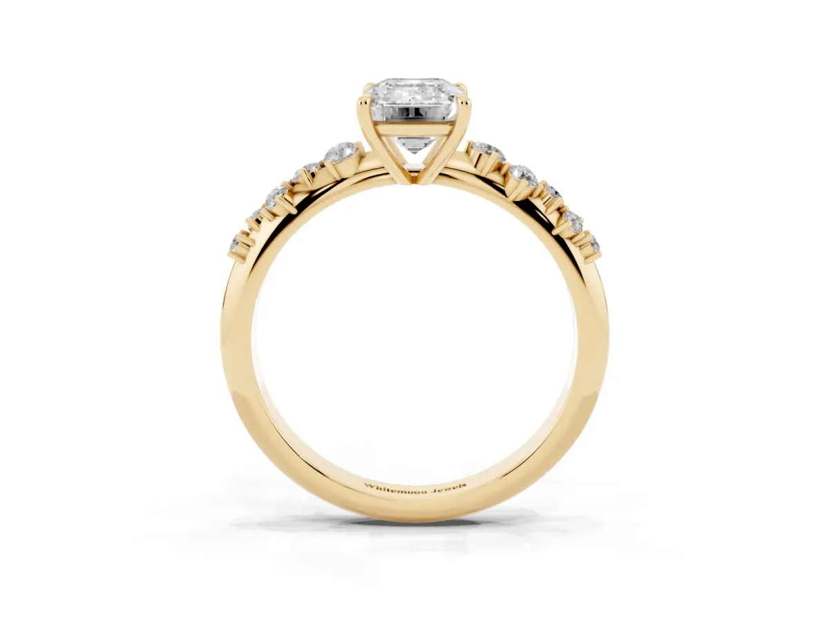 Emerald Cut Diamond Cluster Side Stone Solitaire Ring with Prong Setting Yellow gold