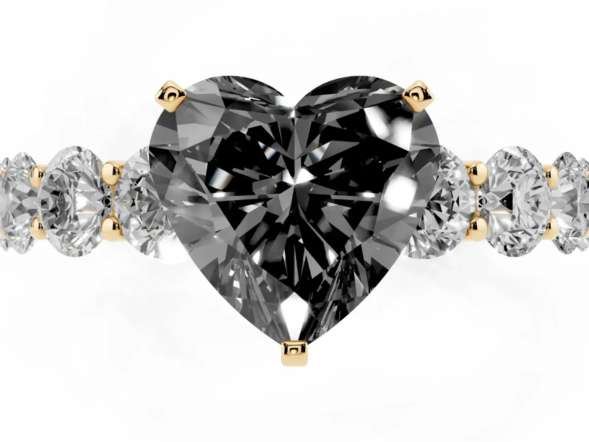 Fancy Black Heart Cut Diamond Prong Setting with Side Stones on a Pave Band Yellow gold