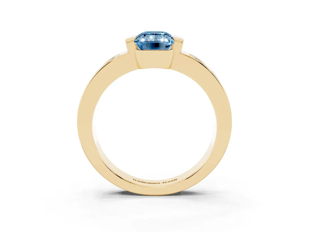 Fancy Blue Emerald Cut Brilliant Channel-Set Diamond Ring with Bezel Prong Setting Yellow gold