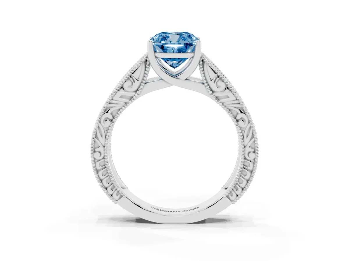 Fancy Blue Cushion Cut Diamond Solitaire Ring with Engraved Band and Four-Prong Setting Platinum