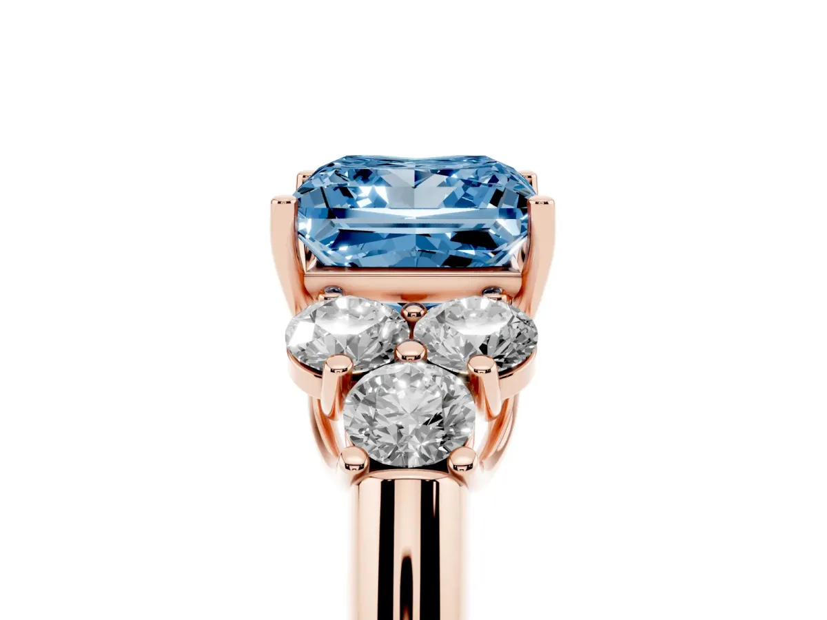 Fancy Blue Princess Cut Cut Diamond Cluster Ring with Round Accent Stones and Prong Setting on a Classic Band Rose gold