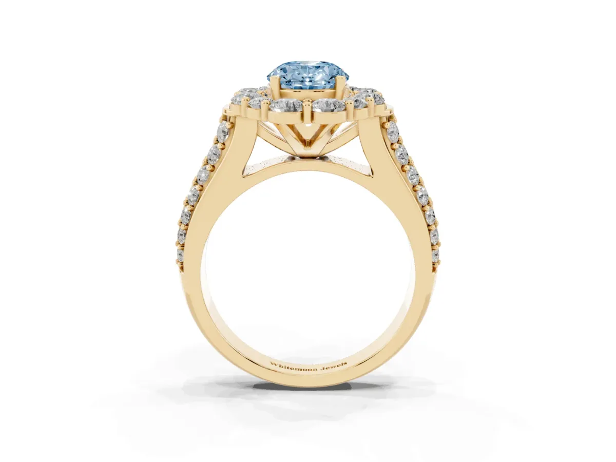 Fancy Blue Oval Cut Halo Diamond Engagement Ring with Split Shank and Prong Setting Yellow gold