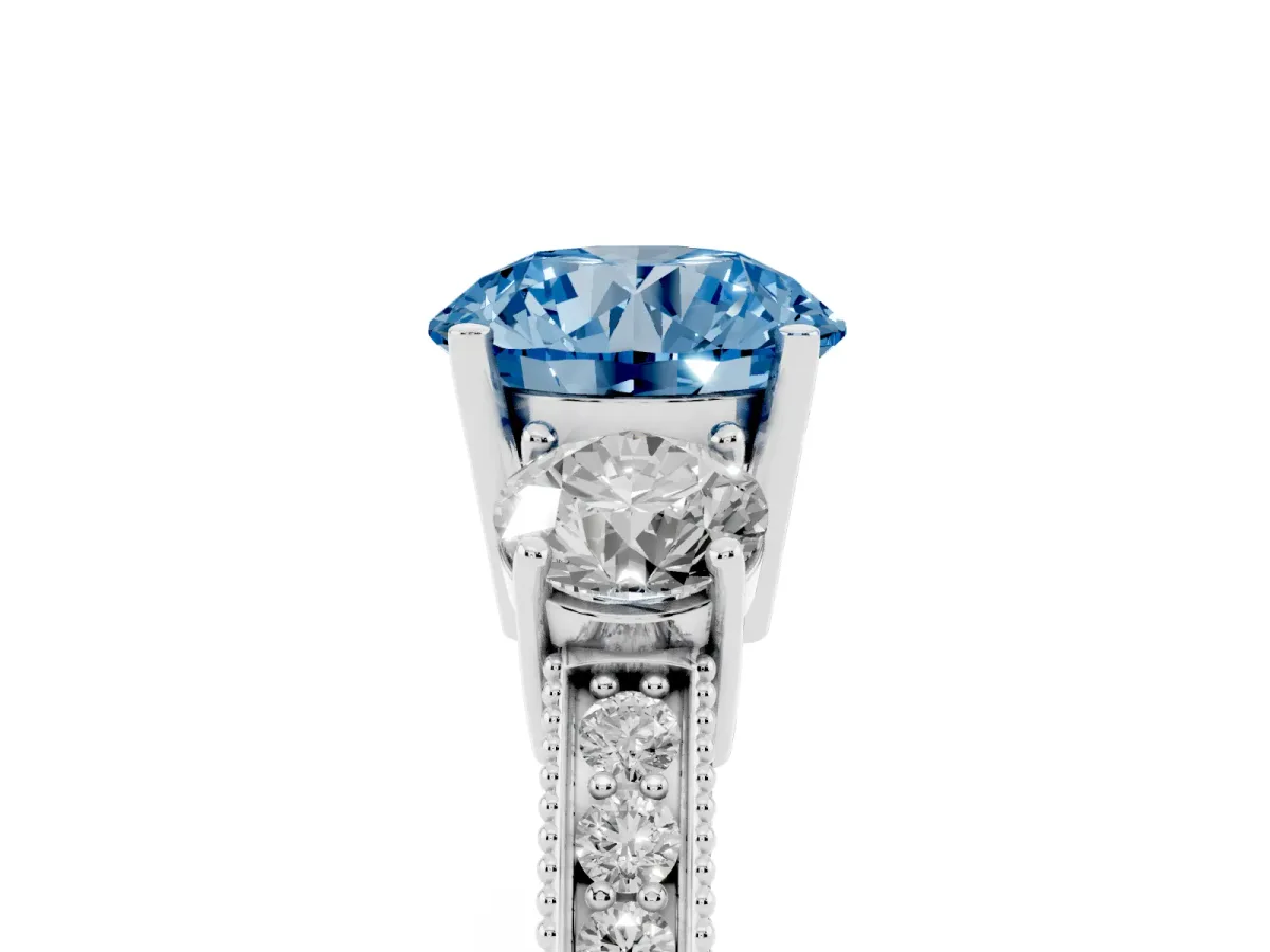 Fancy Blue Round Cut Three-Stone Diamond Ring with Pavé Band and Four-Prong Setting Silver