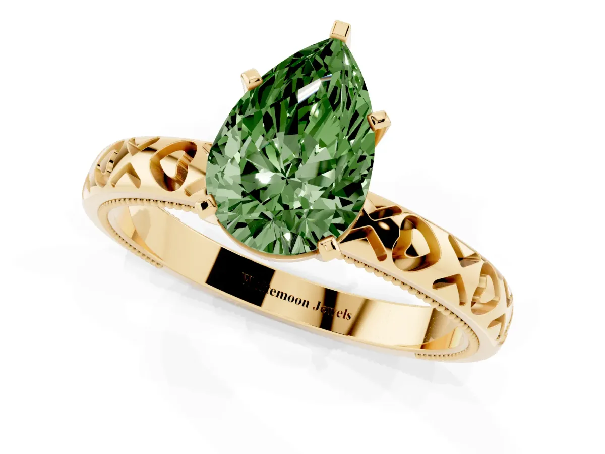 Fancy Green Pear Cut Solitaire Diamond Engagement Ring with XO Engraved Band and Four-Prong Setting Yellow gold
