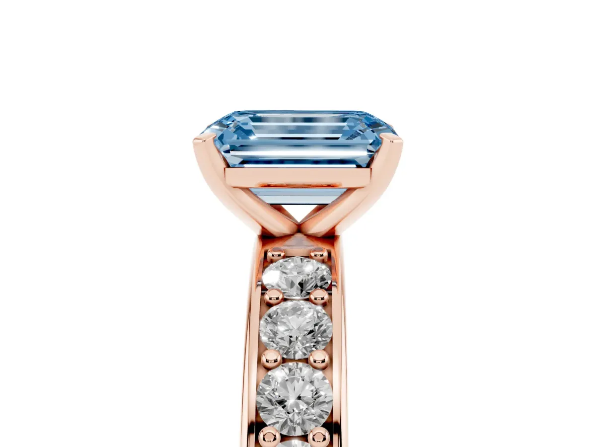 Fancy Blue Emerald Cut Diamond Engagement Ring with Channel Set Round Band and Prong Setting Rose gold