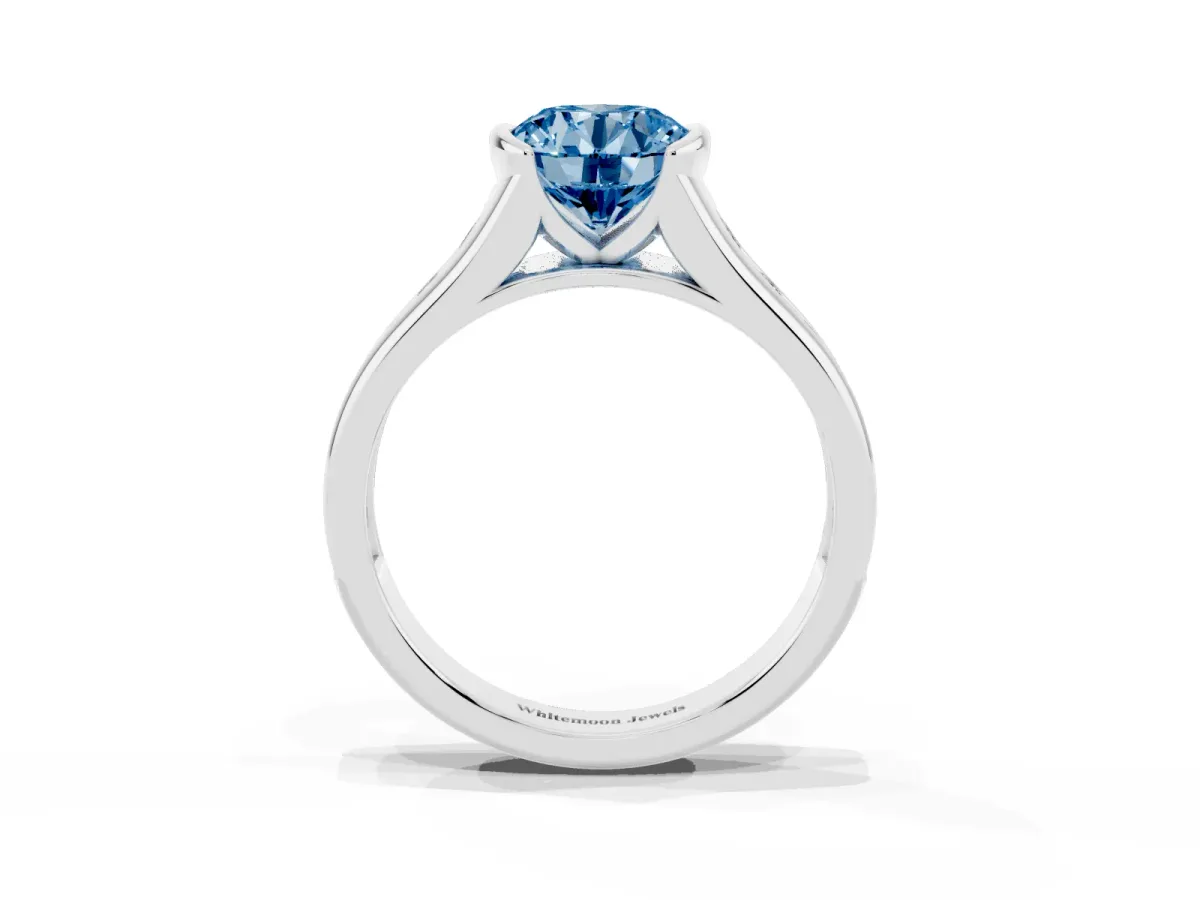 Fancy Blue Round Cut Solitaire Bezel-Set Diamond Ring with Channel-Set Band Platinum
