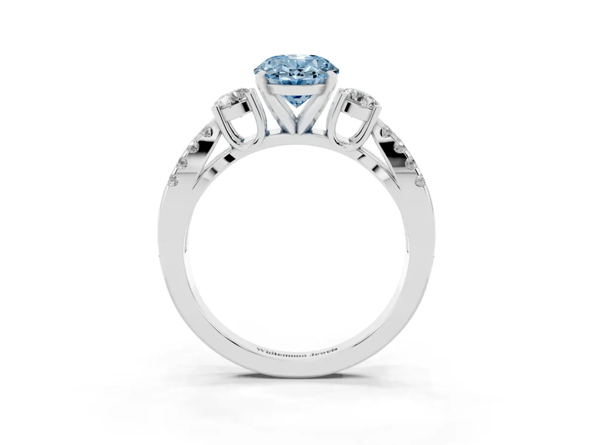 Fancy Blue Oval Cut Diamond Three-Stone Ring with Pavé Split Shank and Four-Prong Setting Silver