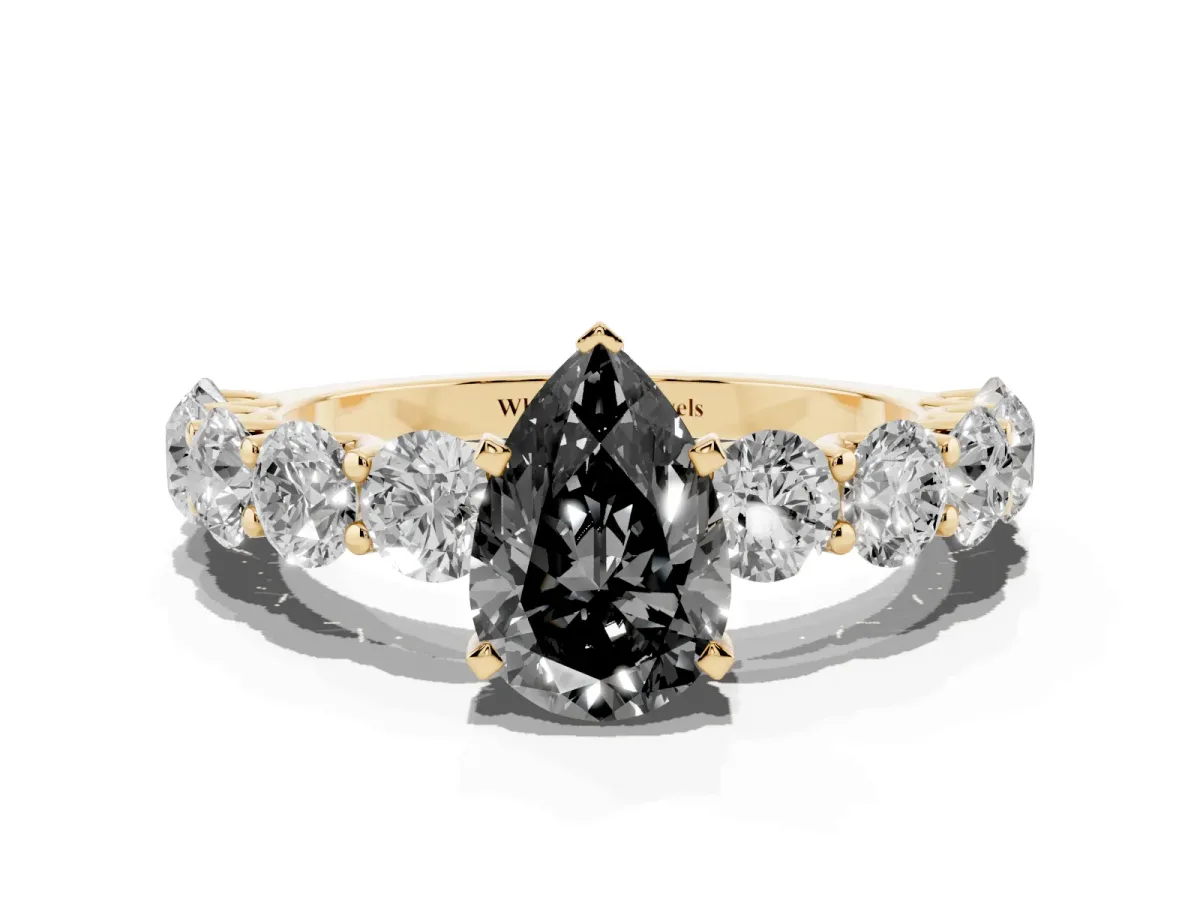 Fancy Black Pear Cut Diamond Prong Setting with Side Stones on a Pave Band Yellow gold