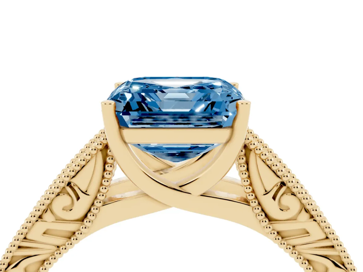 Fancy Blue Asscher Cut Diamond Solitaire Ring with Engraved Band and Four-Prong Setting Yellow gold