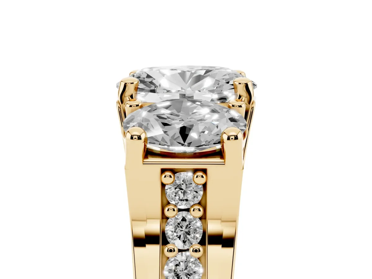 Oval Cut Diamond Three-Stone Ring with Channel Set Band and Four-Prong Setting Yellow gold